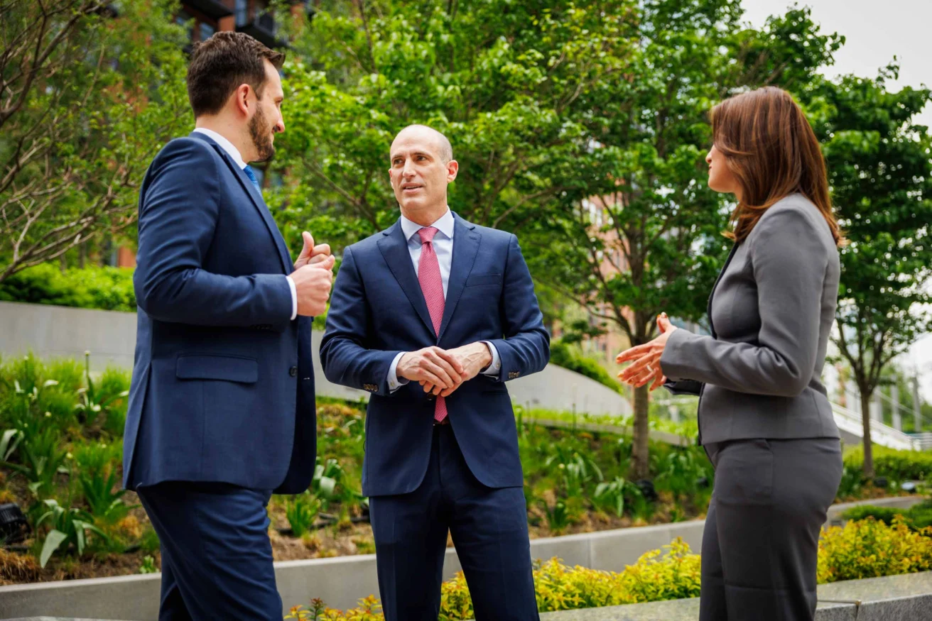 Three lawyers having a conversation.